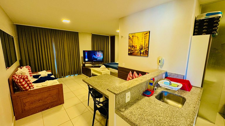 Apartamento com vista para a piscina e acesso direto à praia